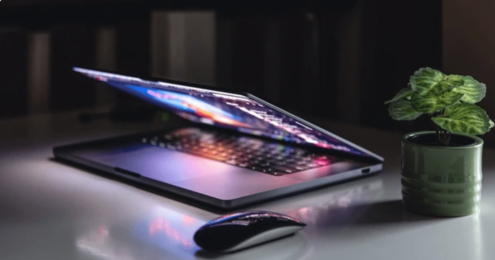 Hands typing on laptop - managing digital life and accounts